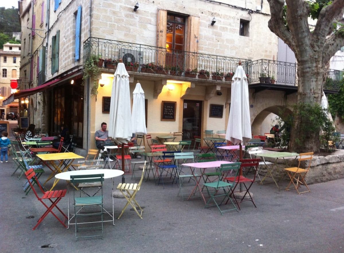 Café tables set out on a shaded square in the old town