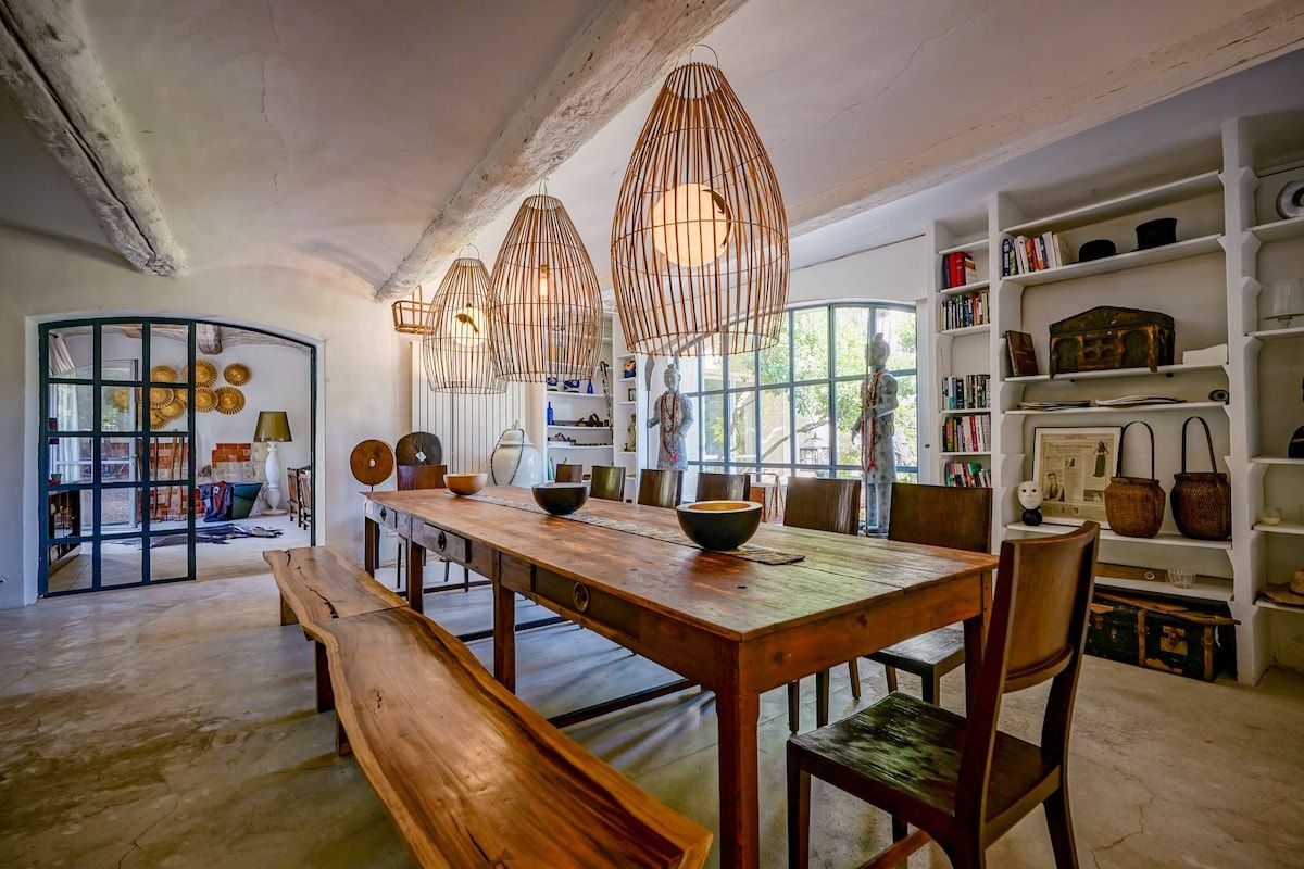 The indoor dining room, with a long wooden table seating up to eighteen